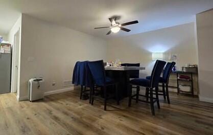 125 Smith Ave, Warsaw, KY 41095 - dining area with ceiling fan, baseboards, and wood finished floors