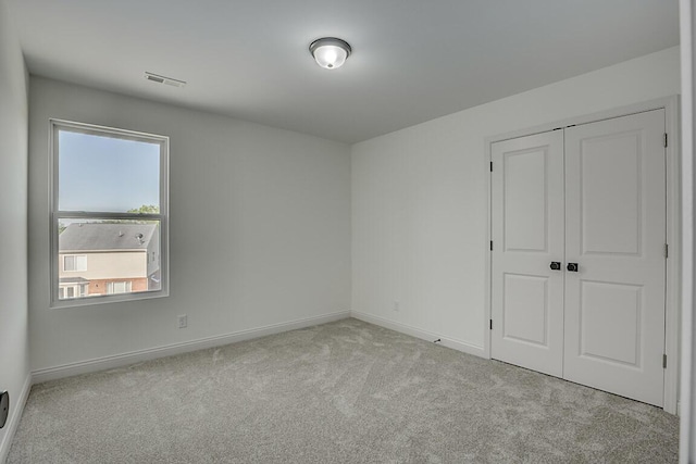 350 Foxhunt Dr, Walton, KY 41094 - unfurnished bedroom featuring carpet, multiple windows, baseboards, and a closet