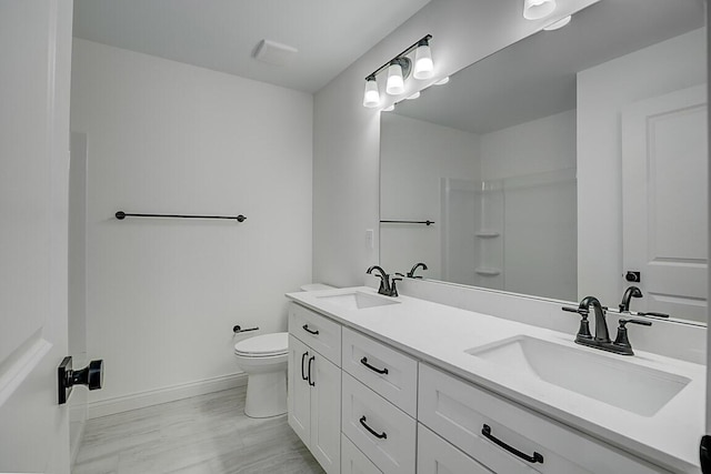 350 Foxhunt Dr, Walton, KY 41094 - bathroom with baseboards, toilet, double vanity, and a shower