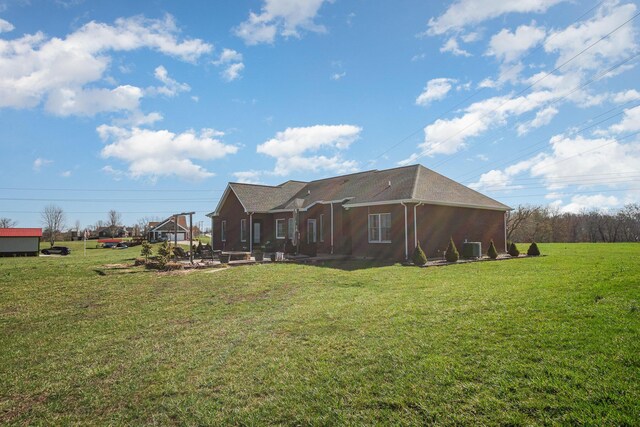 rear view of house with a lawn