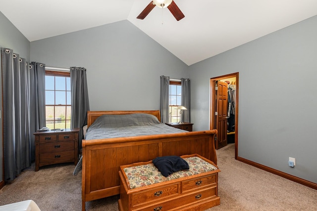 bedroom featuring a spacious closet, light carpet, baseboards, and lofted ceiling