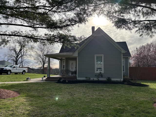 98 S Main St, Dry Ridge, KY 41035 - view of side of home with a lawn, covered porch, fence, and a chimney