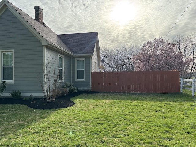 98 S Main St, Dry Ridge, KY 41035 - view of side of property with roof with shingles, fence, and a lawn