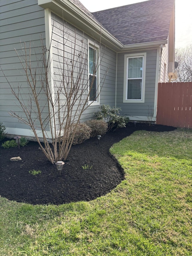 98 S Main St, Dry Ridge, KY 41035 - view of side of property featuring a lawn, a shingled roof, and fence