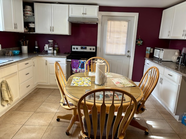 98 S Main St, Dry Ridge, KY 41035 - kitchen featuring stainless steel range with electric cooktop, under cabinet range hood, white cabinetry, white microwave, and light tile patterned floors