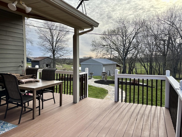 98 S Main St, Dry Ridge, KY 41035 - deck with a lawn, a shed, and an outbuilding