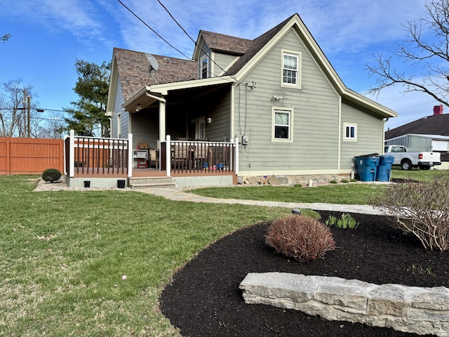 98 S Main St, Dry Ridge, KY 41035 - rear view of house featuring fence, roof with shingles, and a yard
