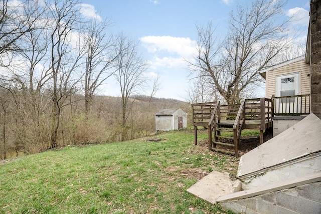 view of yard with an outdoor structure and a shed