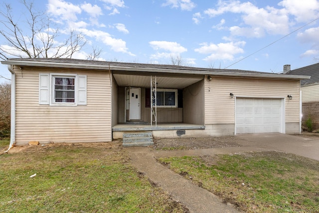 ranch-style house with driveway, covered porch, and a garage