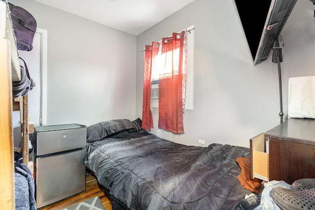 bedroom featuring wood finished floors