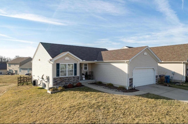 ranch-style home with a front yard, an attached garage, stone siding, and driveway