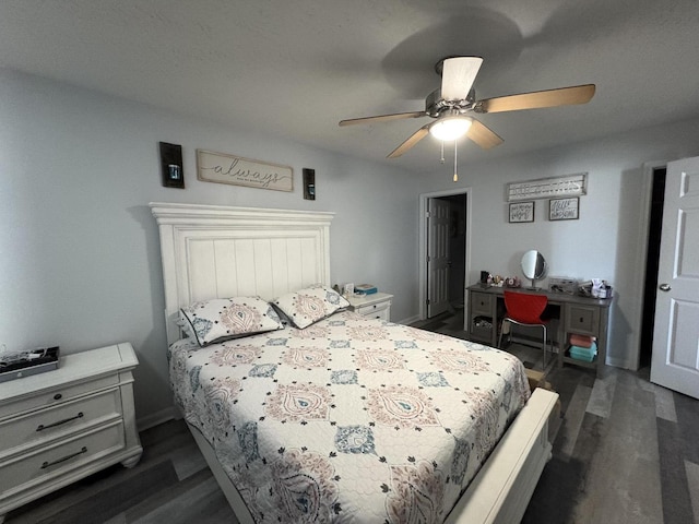 bedroom with dark wood-style flooring and a ceiling fan