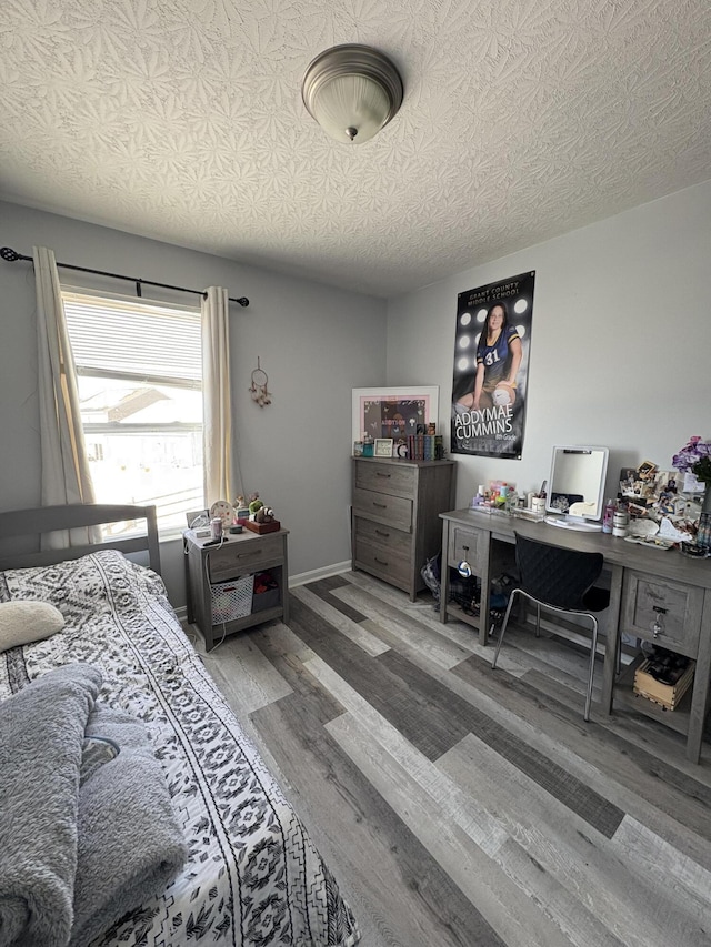 bedroom featuring wood finished floors
