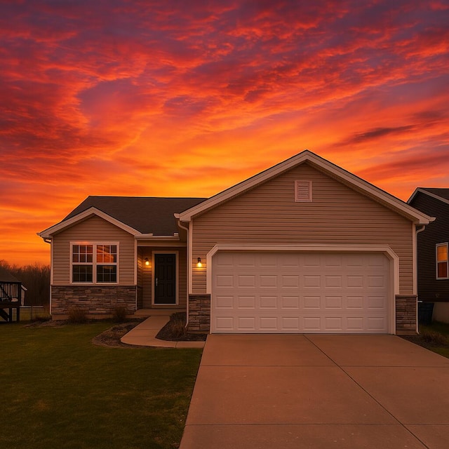 view of front of property with a garage, driveway, stone siding, and a lawn