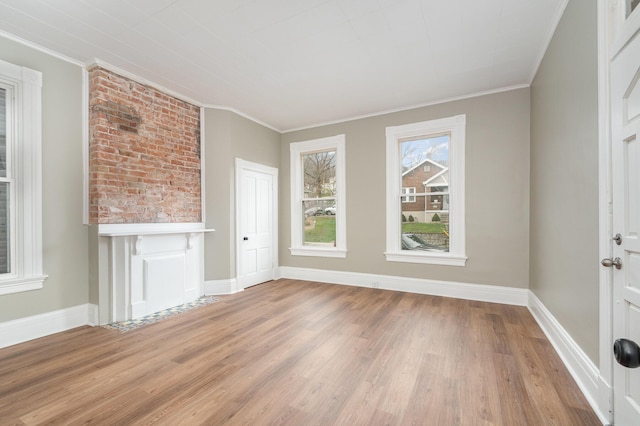 511 Highland Pike, Covington, KY 41014 - unfurnished living room with baseboards, crown molding, and wood finished floors