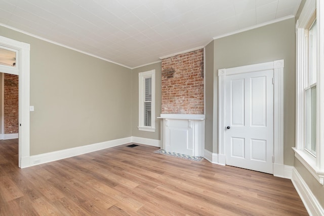 511 Highland Pike, Covington, KY 41014 - unfurnished living room with ornamental molding and light wood-style flooring