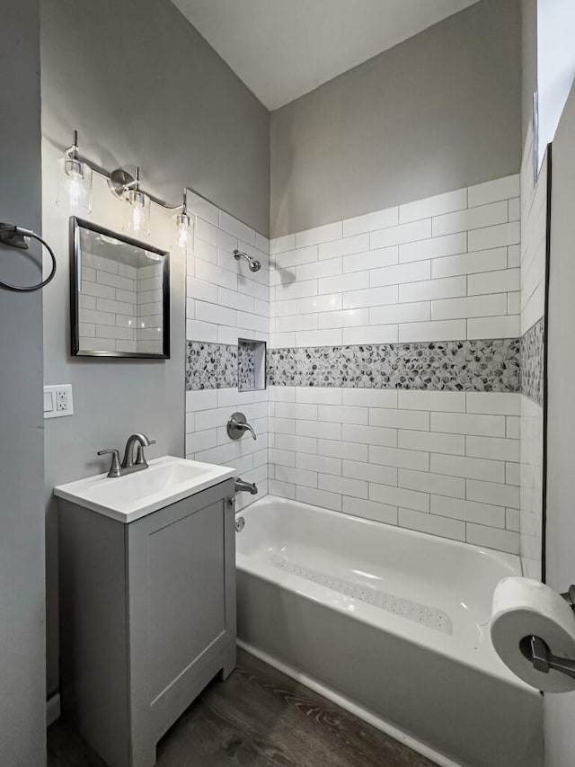 2750 Madison Ave, Covington, KY 41015 - bathroom with bathtub / shower combination, vanity, and wood finished floors