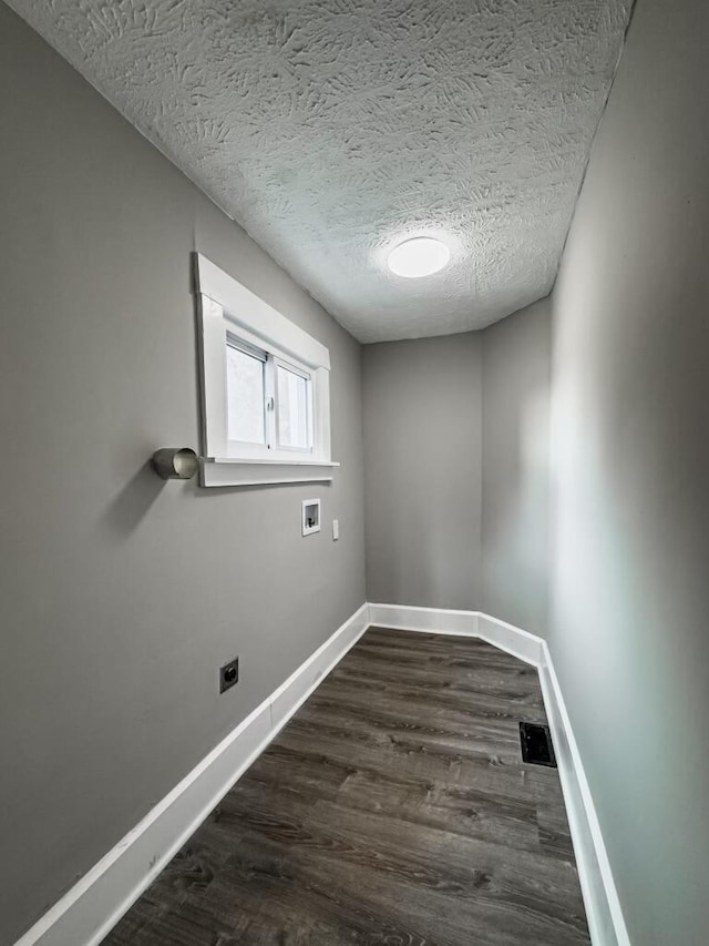 2750 Madison Ave, Covington, KY 41015 - empty room featuring dark wood-style floors, baseboards, a textured ceiling, and visible vents
