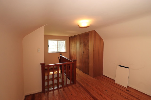 additional living space with wood finished floors