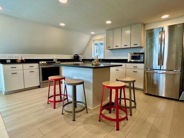 540 Summer Dr, Williamstown, KY 41097 - kitchen with white cabinets, light wood-style flooring, dark countertops, and stainless steel appliances