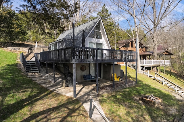 540 Summer Dr, Williamstown, KY 41097 - back of house featuring an outdoor fire pit, a lawn, a patio, stairs, and a wooden deck