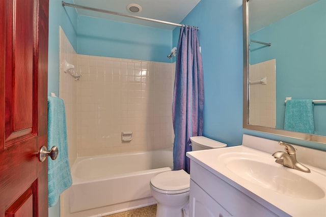 bathroom with shower / bath combination with curtain, vanity, and toilet