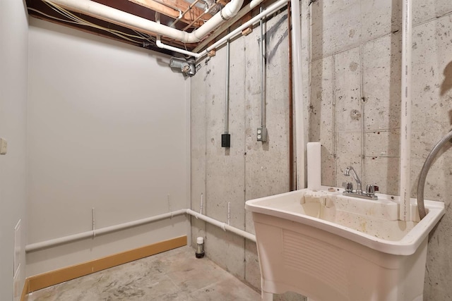 unfinished basement featuring a sink