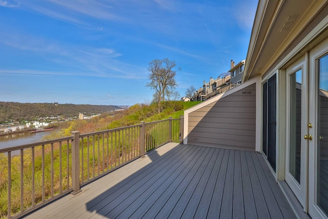 wooden deck with a water view