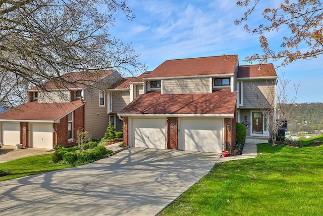 traditional-style home featuring a garage, a front lawn, brick siding, and concrete driveway