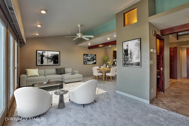 living area with ceiling fan, lofted ceiling, carpet flooring, and baseboards