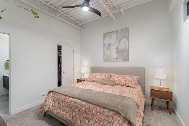 bedroom featuring ceiling fan, a closet, carpet flooring, and baseboards
