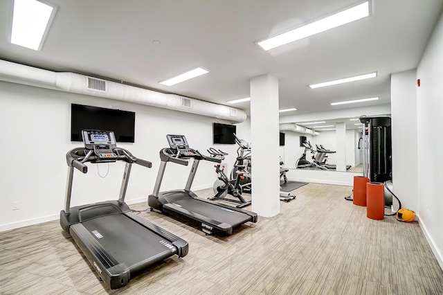 gym featuring visible vents and baseboards