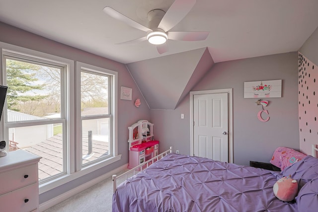 carpeted bedroom with baseboards, a ceiling fan, and lofted ceiling