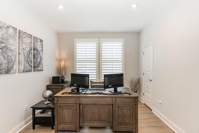 office space featuring light wood finished floors, baseboards, and recessed lighting