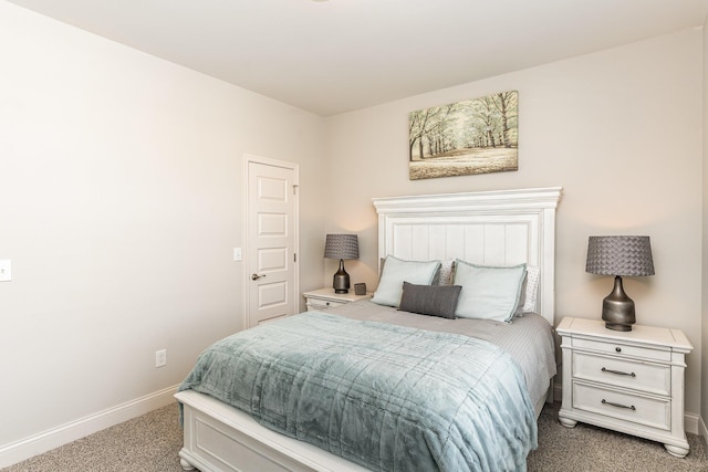 bedroom featuring carpet flooring and baseboards