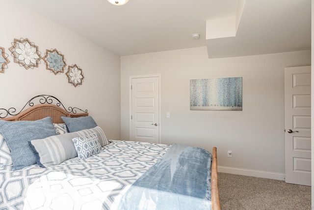 carpeted bedroom with baseboards