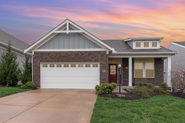 view of front facade with brick siding, driveway, an attached garage, and board and batten siding