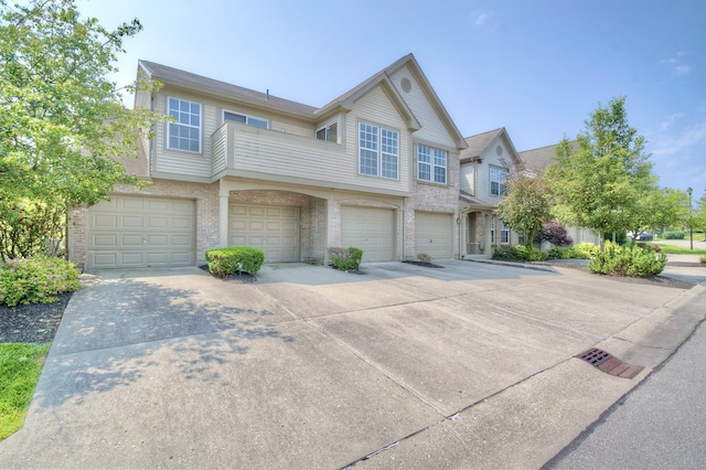 7370 Centrecrest Ln Unit E, Florence, KY 41042 - multi unit property featuring driveway, a garage, and brick siding