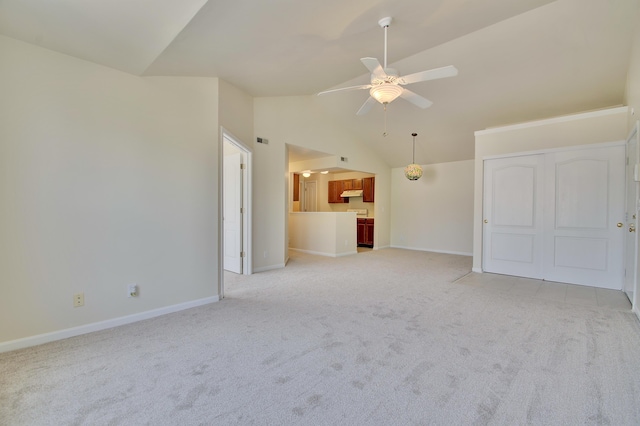 7370 Centrecrest Ln Unit E, Florence, KY 41042 - unfurnished living room with light carpet, ceiling fan, baseboards, and lofted ceiling