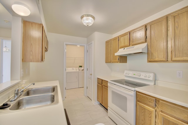 7370 Centrecrest Ln Unit E, Florence, KY 41042 - kitchen with under cabinet range hood, white range with electric cooktop, washing machine and dryer, a sink, and light countertops
