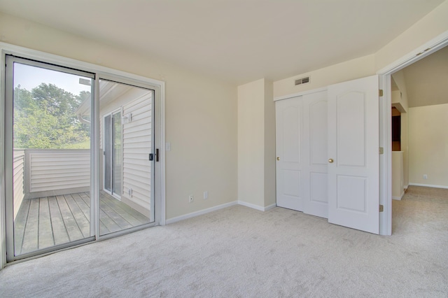 7370 Centrecrest Ln Unit E, Florence, KY 41042 - unfurnished bedroom featuring access to outside, carpet flooring, and baseboards