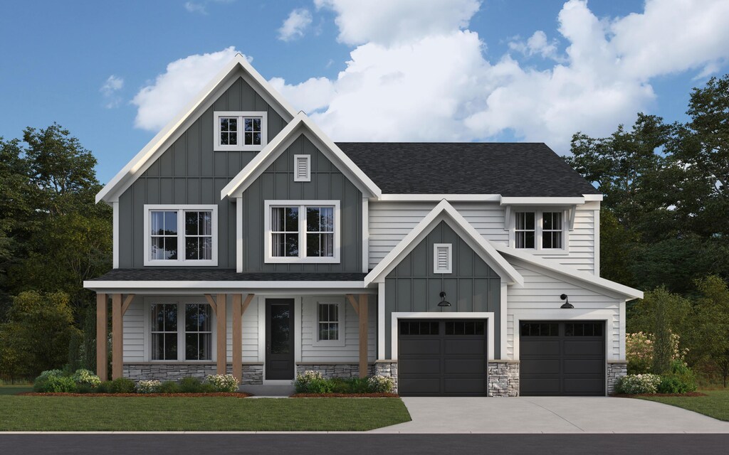 923 Fairbanks Ln, Southgate, KY 41071 - view of front of house with a garage, stone siding, and board and batten siding