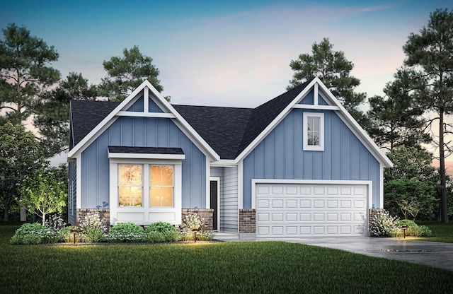 view of front of house featuring board and batten siding, a shingled roof, a lawn, and driveway