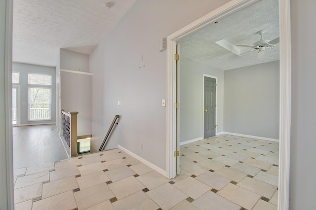 2141 Tantallon Dr, Fort Mitchell, KY 41017 - hallway with baseboards, a textured ceiling, and an upstairs landing