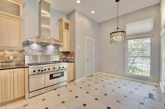2141 Tantallon Dr, Fort Mitchell, KY 41017 - kitchen with wall chimney exhaust hood, range with two ovens, baseboards, tasteful backsplash, and visible vents
