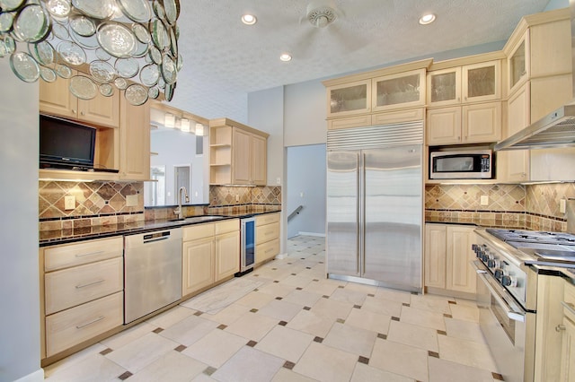 2141 Tantallon Dr, Fort Mitchell, KY 41017 - kitchen with built in appliances, wine cooler, dark countertops, light floors, and a sink