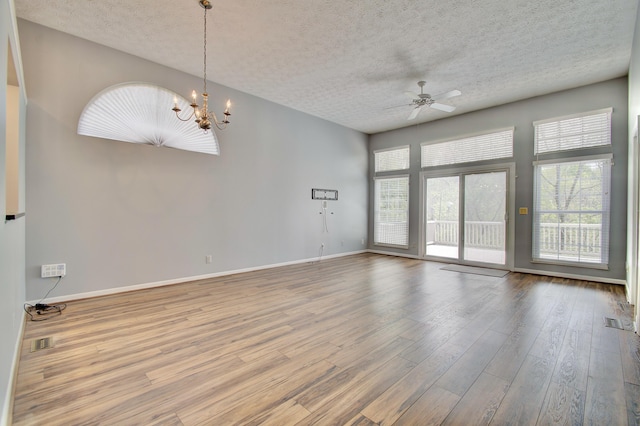 2141 Tantallon Dr, Fort Mitchell, KY 41017 - spare room with visible vents, a textured ceiling, ceiling fan with notable chandelier, and wood finished floors