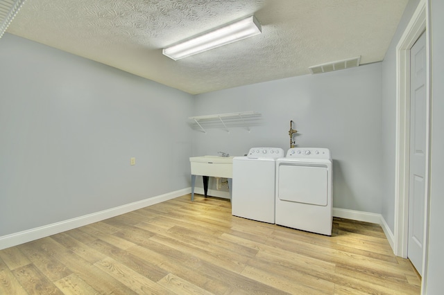 2141 Tantallon Dr, Fort Mitchell, KY 41017 - laundry area featuring separate washer and dryer, laundry area, light wood-style flooring, and visible vents