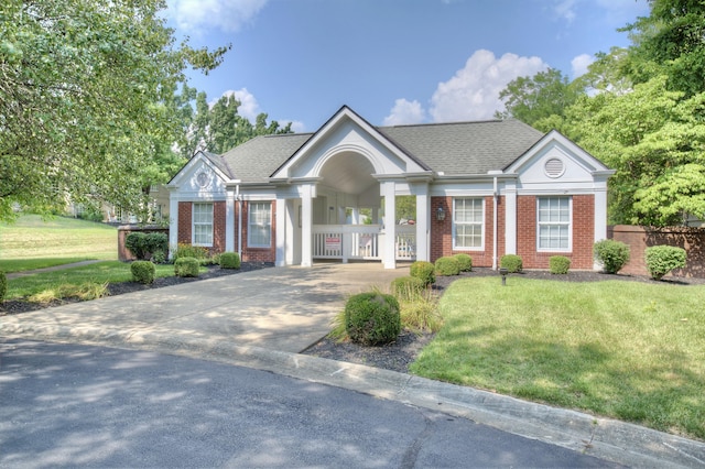 2141 Tantallon Dr, Fort Mitchell, KY 41017 - view of front of house featuring fence, a front yard, roof with shingles, brick siding, and concrete driveway