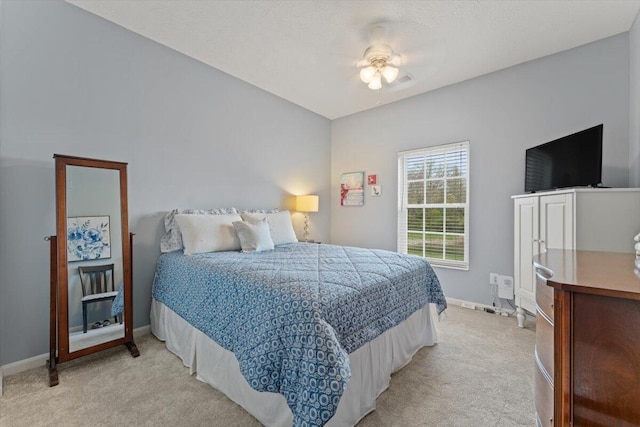 bedroom featuring baseboards and light colored carpet